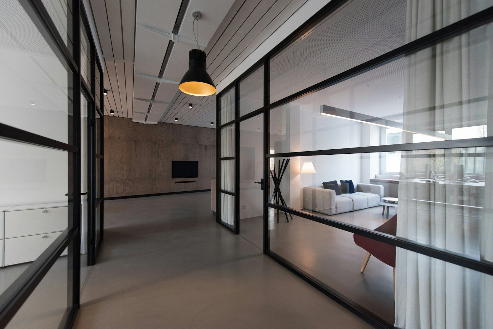 Managed commercial building corridor illustrating the type of interior environment where compartmentation interfaces occur.